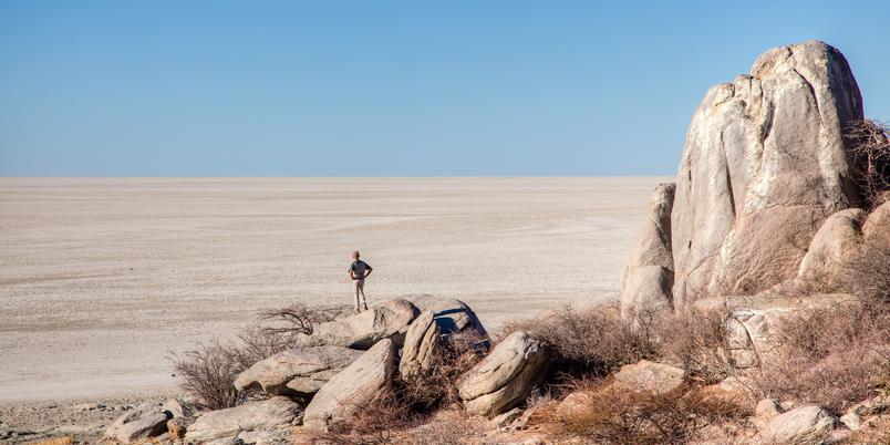 Lone man view across Makgadikgadi pans SS