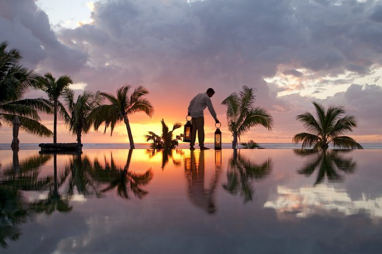 Lux Le Morne main pool at dusk