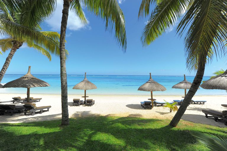 Trou Aux Biches Sunbeds on beach