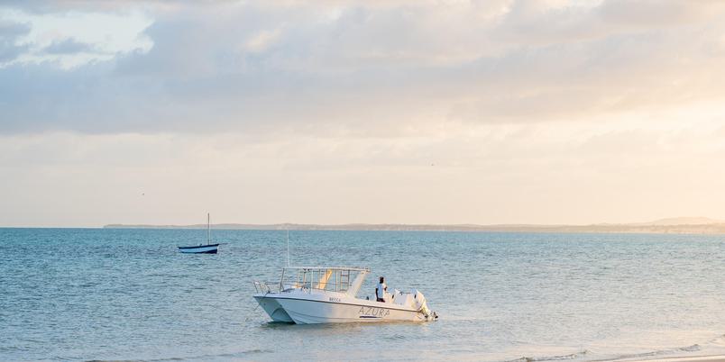 Azura Benguerra boats by beach