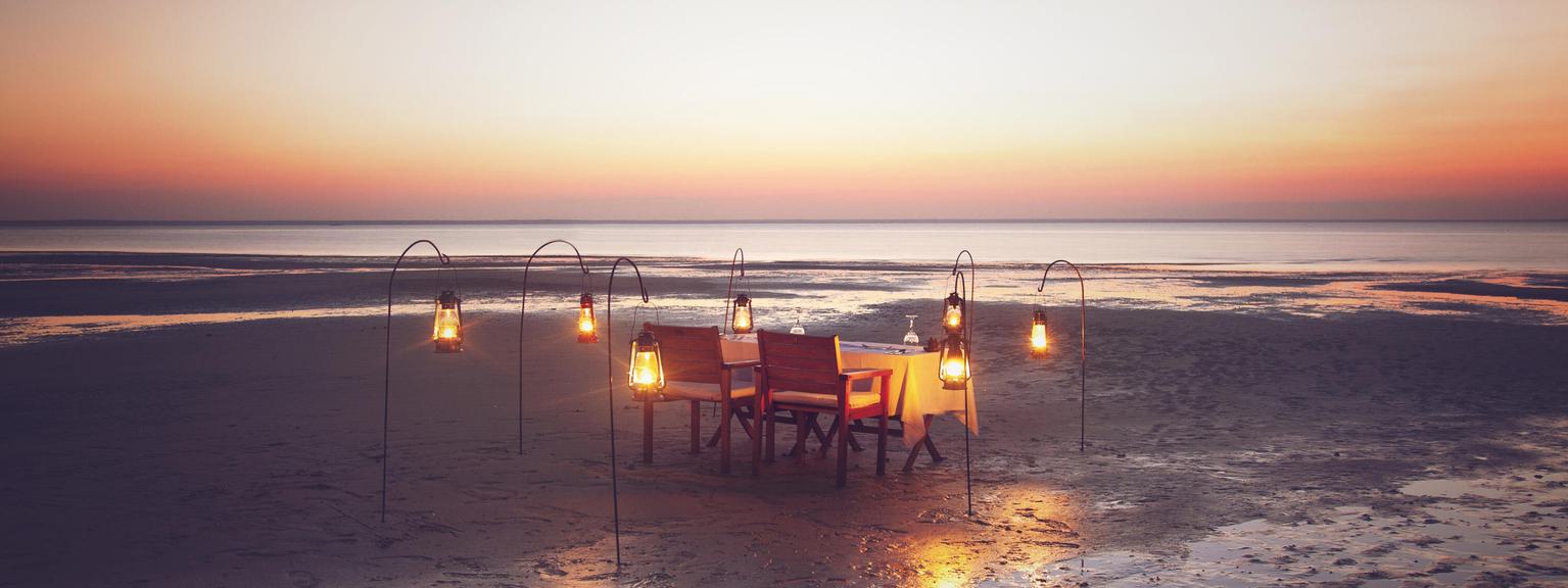 Azura Benguerra dining on the beach