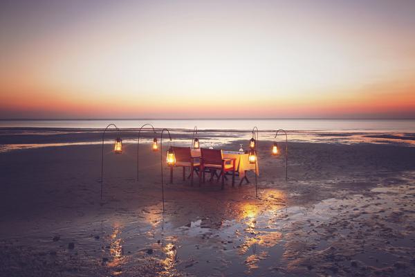 Azura Benguerra dining on the beach