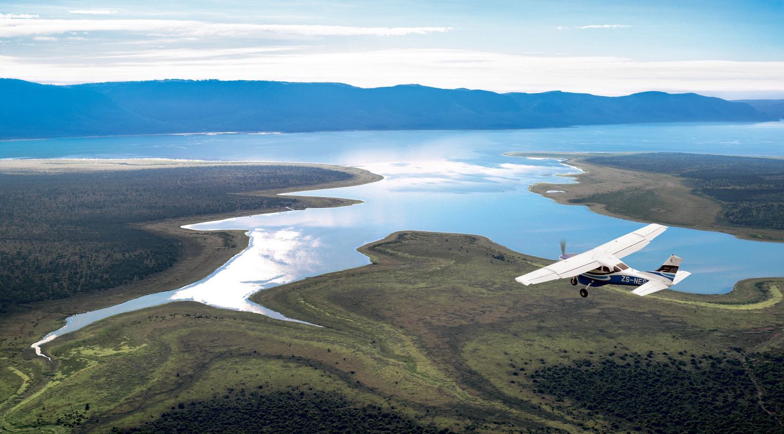 Plane flying over lake at Phinda KZN SAT