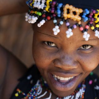 Smiling colourful dancer Phezulu Safari Park Valley of a Thousand Hills KZN SAT
