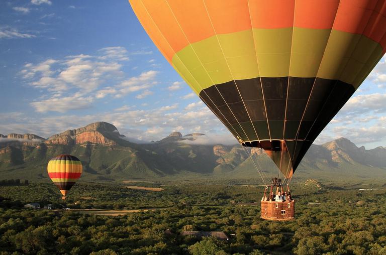 Hot air Balloon safari with mountain backdrop Thornybush Game Reserve