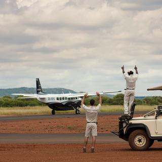 Morukuru Family Madikwe Aircraft on tarmac waving square