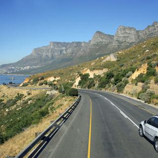 Twelve apostles and lions head from road with car
