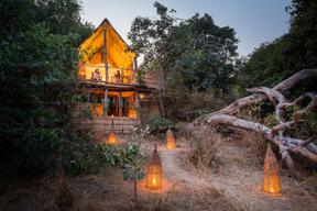 Chikoko Tree Camp Treehouse Exterior by Night