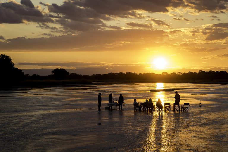 Kapamba Bush Camp sundowner drinks in river