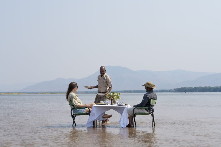 Potato Bush Camp river lunch couple being served