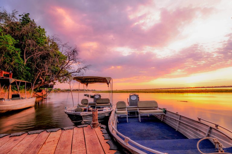 Royal Zambezi Lodge boats at jetty sunset