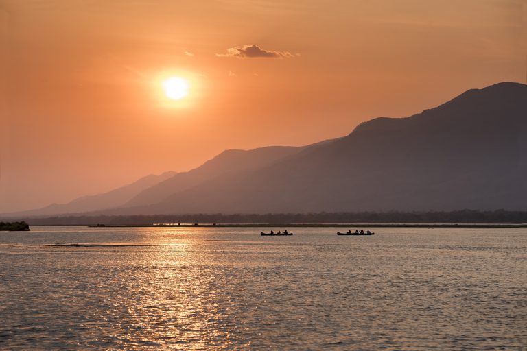 Canoes at sunset zambezi river mana pools