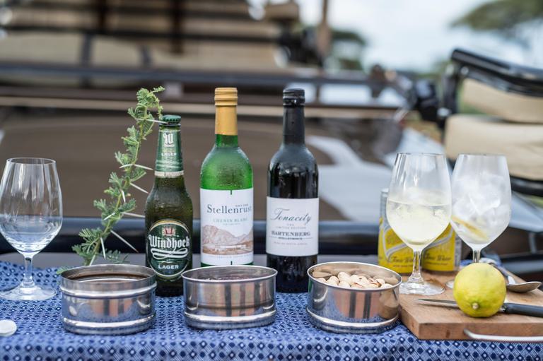 Sundowner food and drink on game vehicle Singita Pamushana