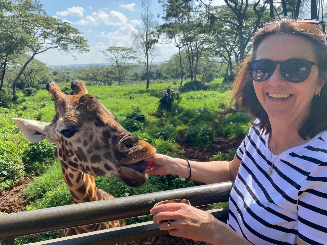 Nicky feeding giraffe