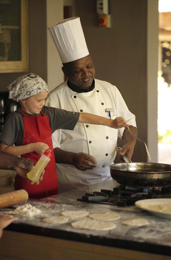 Child and Chef cooking Kichwa Tembo