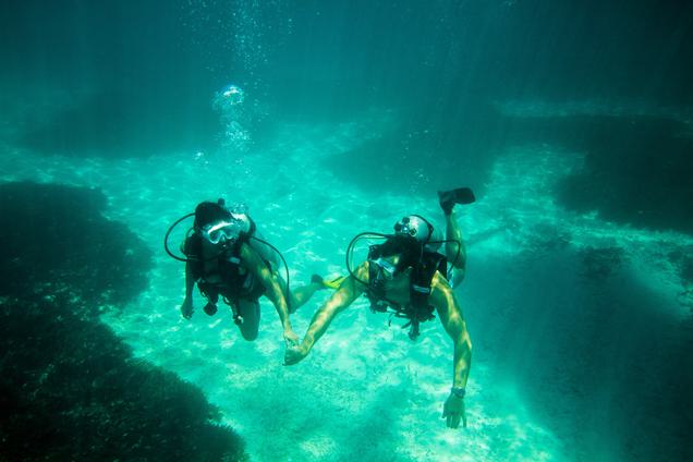 Denis Island Seychelles Diving Couple holding hands