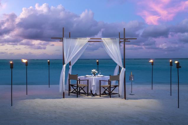 Romantic beach dining setup Maldives