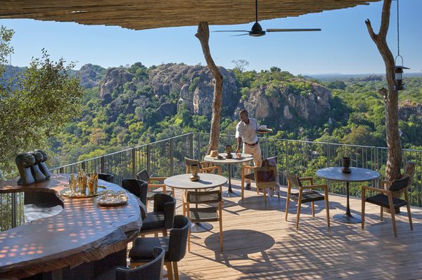 Singita Pamushana Lodge Deck Overlooking Dam with waiter
